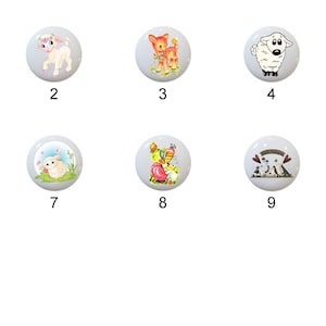 May include: Eleven ceramic knobs with different animal designs, including lambs, a deer, and a pig. The knobs are white with colorful designs.