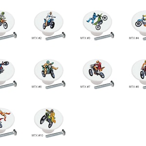 May include: Ten different ceramic knobs with images of motocross riders on them. The knobs are white with a silver screw.