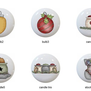 May include: A collection of ten white ceramic cabinet knobs with Christmas-themed designs. The knobs feature illustrations of ornaments, candles, a stocking, and a candle trio, with various colors and patterns.