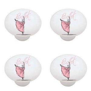 May include: Four white ceramic cabinet knobs with a pink ballerina illustration and the word "Ballet" in pink script.