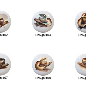 May include: A collection of ten white ceramic cabinet knobs, each featuring a watercolor painting of a cowboy hat. The hats vary in color and style, with details like feathers and shading. Each knob is labeled with a design number.