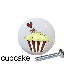 May include: Five white ceramic knobs with different Christmas-themed designs. The designs include a border of candy canes, two candy canes with a bow, a cupcake with a heart, a milkshake with a cherry and an umbrella, and the word "Peppermint". Each knob has a silver screw.