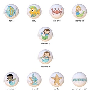 May include: Set of 10 ceramic knobs featuring various sea creatures, including fish, crabs, mermaids, seaweed, and a starfish. The knobs are painted in bright colors and have a whimsical, cartoon-like style.