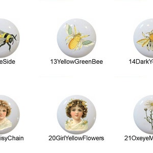 May include: Set of 11 ceramic knobs with various designs, including a yellow rose, bees, butterflies, a girl with flowers, and daisies. The knobs are white with a glossy finish.