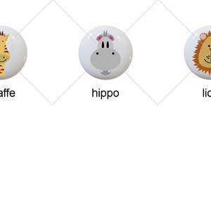 May include: Six round ceramic knobs with animal faces. The animals are an elephant, giraffe, hippo, lion, monkey, and zebra.
