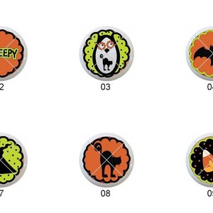 May include: Nine round Halloween-themed buttons with orange, black, and yellow designs. The designs include an owl, a bat, a pumpkin, a spider, a witch, a cat, and candy corn.