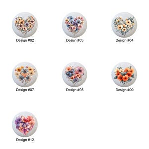 May include: Twelve different designs of ceramic heart-shaped tiles with floral patterns. Each tile features a different arrangement of flowers in shades of pink, blue, yellow, and orange.