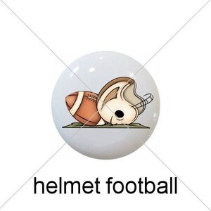 May include: Five white ceramic knobs with different football-themed designs. The designs include a football, a helmet, a helmet with a football, a sign with the number one, and the word "FOOTBALL" in brown letters.