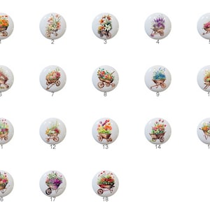 May include: A set of 18 ceramic tiles featuring a watercolor illustration of a wheelbarrow filled with colorful flowers. Each tile is numbered 1 through 18.