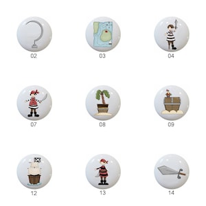 May include: A collection of fifteen white ceramic cabinet knobs with pirate-themed designs. The knobs feature illustrations of pirates, treasure maps, ships, and pirate symbols. Each knob is numbered from 01 to 15.
