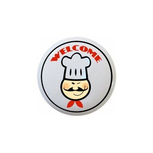 May include: A white round sign with a red border and the word "WELCOME" in red letters. A cartoon chef with a white chef's hat, red cheeks, a black mustache, and a red bow tie is in the center of the sign.
