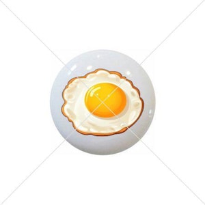 May include: A cartoon illustration of a fried egg with a bright yellow yolk and a white egg white.