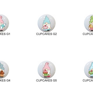 May include: Six round ceramic ornaments featuring a cartoon gnome holding a cupcake. Each gnome is wearing a different colored hat and holding a different cupcake. The ornaments are labeled "CUPCAKES G1", "CUPCAKES G2", "CUPCAKES G3", "CUPCAKES G4", "CUPCAKES G5", and "CUPCAKES G6".