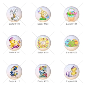 May include: Fifteen round ceramic Easter-themed ornaments with various designs, including chicks, bunnies, eggs, and baskets. The ornaments are white with colorful designs.