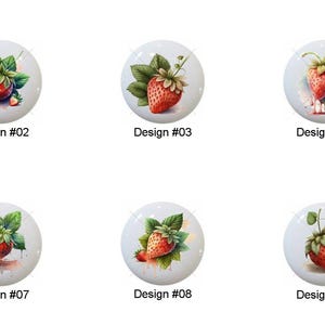 May include: A collection of ten white ceramic buttons, each featuring a watercolor illustration of a ripe strawberry with green leaves. Each button is labeled with a design number from #01 to #10.