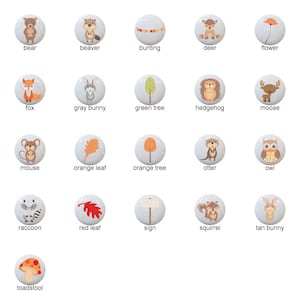 May include: A set of 16 ceramic knobs featuring woodland creatures, leaves, and other nature-themed designs. The knobs are white with colorful illustrations.