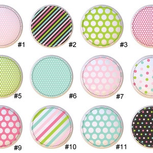 May include: Twelve different patterned circles with numbers 1 through 12 below each circle. The patterns include pink polka dots, green polka dots, black and white stripes, and a honeycomb pattern.