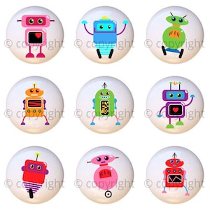 May include: Nine colorful robot designs on white round ceramic knobs. The robots are in various poses and have different colored bodies, antennas, and eyes.