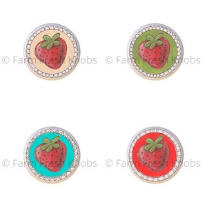 May include: Four round ceramic knobs with a silver metal rim. Each knob features a red strawberry with green leaves on a different colored background: beige, green, turquoise, and red.