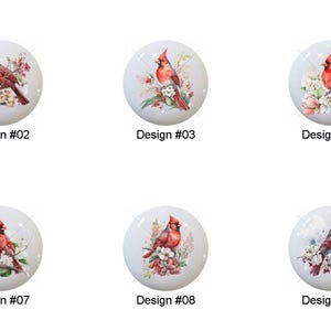 May include: A collection of ten white ceramic cabinet knobs, each featuring a watercolor design of a red cardinal bird perched among flowers. Each knob is labeled with a design number from #01 to #10.