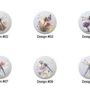 May include: A collection of ten white ceramic cabinet knobs, each featuring a unique dragonfly design with floral accents. The knobs are labeled with the design number from #01 to #10. The dragonfly designs vary in color and style, with a watercolor aesthetic.