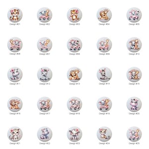 May include: A collection of 25 white cabinet knobs with various animal designs. Each knob features a different animal, including tigers, elephants, giraffes, and lions, with floral accents. Each knob is labeled with a design number.