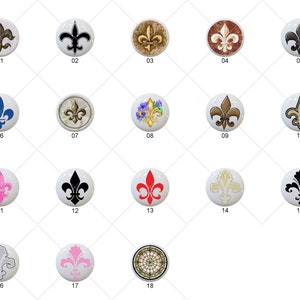 May include: A set of 18 different designs of round ceramic knobs with a fleur-de-lis motif. The knobs are in various colors, including black, white, gold, red, blue, and pink. The knobs are numbered 1 through 18.