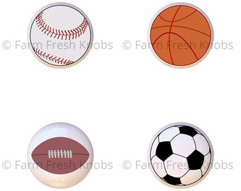 May include: Four different sports ball designs on white ceramic knobs. The designs are a baseball, basketball, football, and soccer ball.