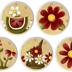 May include: Five round ceramic knobs with a beige background and a variety of floral designs. The designs include a watermelon with a daisy growing out of it, a single red flower, a cluster of three red flowers, a cluster of three white flowers with a red flower in the center, and a single red flower with a yellow center.