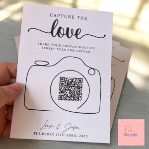 May include: A white card with black text, including "CAPTURE THE love" and "SHARE YOUR PHOTOS WITH US! SIMPLY SCAN AND UPLOAD." A camera outline with a QR code is featured. The names "Louise & Jason" and the date "THURSDAY 17TH APRIL 2025" are at the bottom.