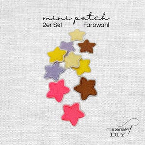 Könnte beinhalten: Eine Ansammlung kleiner, gestickter sternförmiger Aufnäher in verschiedenen Farben wie Gelb, Helllila, Braun und leuchtendem Pink. Der Text "mini patch 2er Set Farbwahl" ist oben und "material4 DIY" ist unten im Bild zu sehen.
