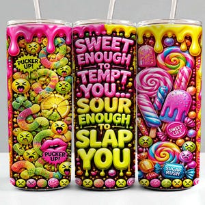 May include: Three cylindrical tumblers with straws featuring a vibrant candy-themed design. The graphics include colorful gummy worms, lollipops, melting icing, and emojis. The center tumbler displays the text: SWEET ENOUGH TO TEMPT YOU... SOUR ENOUGH TO SLAP YOU.
