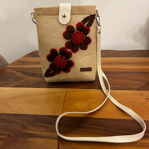 cream-colored crossbody bag