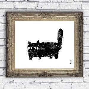 May include: A framed art print featuring a black cat illustration. The cat is depicted in a minimalist style with bold brushstrokes against a white background. The frame is ornate with a gold finish, mounted on a white brick wall.