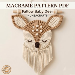 May include: A macramé wall hanging shaped like a baby deer head, featuring tan and cream cotton cord, closed eyes, a dark brown nose, and white spots. The text reads MACRAMÉ PATTERN PDF, Fallow Baby Deer, HUNZACRAFTS, and BESTSELLER.