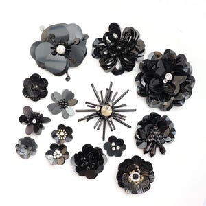 May include: Assortment of black sequin flower embellishments with rhinestone centers. These decorative flowers are perfect for adding a touch of sparkle to clothing, bags, and other crafts.