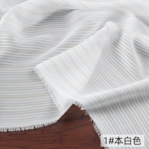 May include: White fabric with a striped pattern. The fabric has a delicate, sheer appearance with thin, vertical stripes in white and a subtle gold color. The edges are unfinished, giving it a raw, textured look. The text "1# 本白色" is visible.