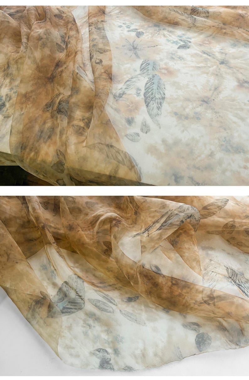 May include: A sheer fabric with a brown and white leaf pattern. The fabric is translucent and has a delicate texture.