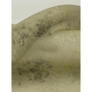 May include: A sage green fabric featuring a subtle, tonal floral pattern woven into the material. The textile displays a soft, matte finish with visible horizontal and vertical weave lines, creating a textured appearance across the surface.