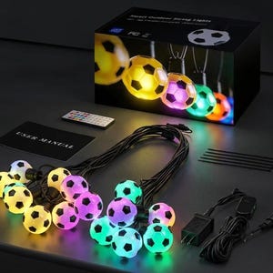 May include: Smart outdoor string lights featuring soccer ball-shaped bulbs that glow in various colors. The set includes a black power cord, a power adapter, a remote control, a user manual, and several black cable ties for installation.