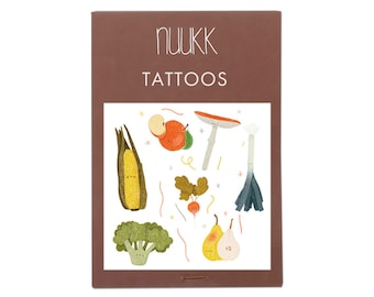 May include: A sheet of temporary tattoos featuring a variety of colorful fruits and vegetables, including a pear, an apple, a mushroom, a leek, a corn cob, and a radish. The sheet is labeled "Nukk Tattoos".