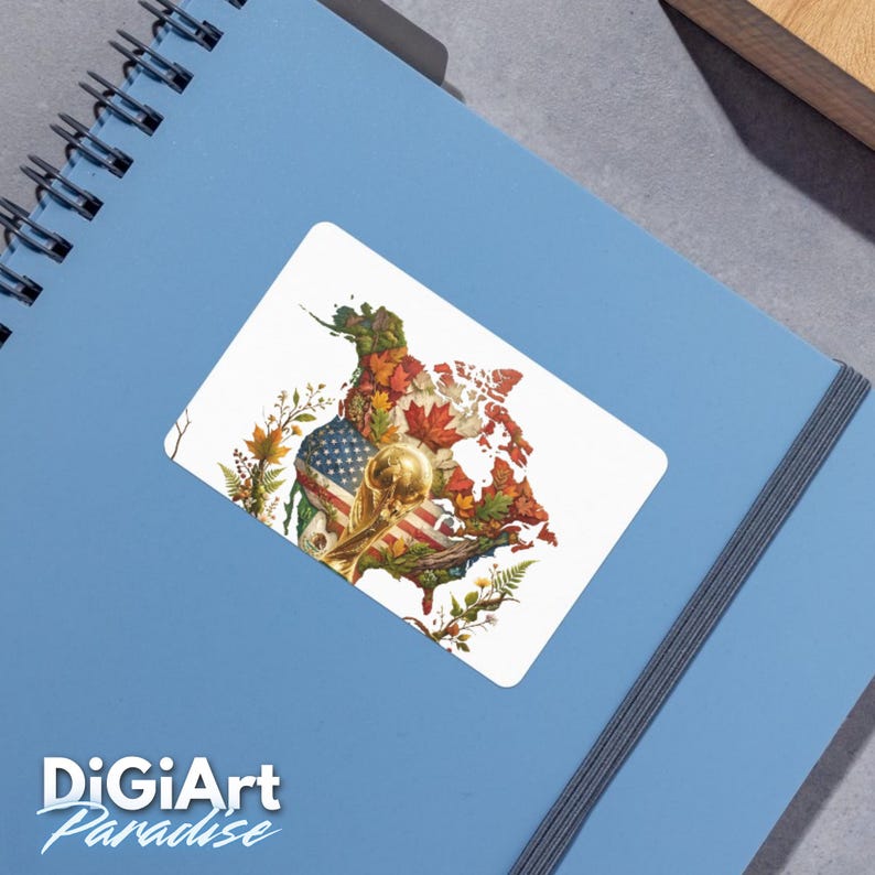May include: A white sticker featuring a map of North America, with the United States flag and autumn leaves. A golden trophy is also featured. The sticker is on a blue notebook. The text "DigiArt Paradise" is at the bottom.