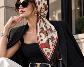 May include: A square silk headscarf featuring a cream background with a repeating equestrian print of horses and riders in red, brown, and blue, finished with a black and red border. The scarf is tied under the chin, worn with a black blazer.