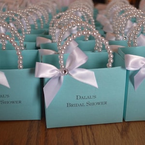 Blue favor bag with pearl handles