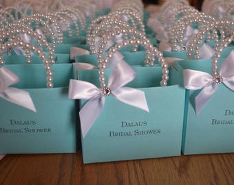 Blue favor bag with pearl handles