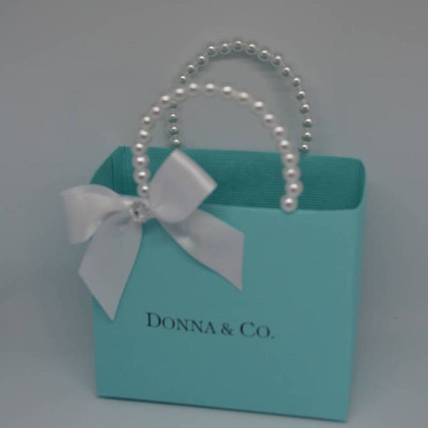 Blue party favor bag with pearl handles