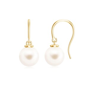 May include: A pair of gold-colored drop earrings with a classic design. Each earring features a lustrous, round white pearl suspended from a delicate gold hook. The earrings are set against a clean white background, highlighting their elegant simplicity.