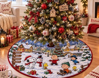 May include: A round Christmas tree skirt featuring a Peanuts holiday scene with Snoopy, Woodstock, Charlie Brown, and Linus in a snowy village. The design includes a wooden sign with the words Peace, Joy, Friends, and Always, surrounded by gifts.