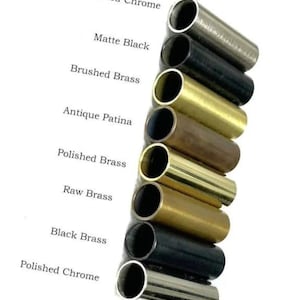May include: A collection of metal tubes in various finishes, including Brushed Chrome, Matte Black, and Polished Brass. The image displays the different color options available, with text labels identifying each finish. The tubes are cylindrical and have a polished appearance.