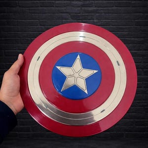 May include: A rustic wooden sign with the text "Welcome to our home" in white lettering. The sign features a distressed finish and a simple, inviting design, perfect for entryway decor.